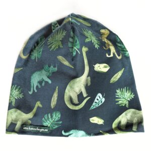mössa med dinosaurier på grönt