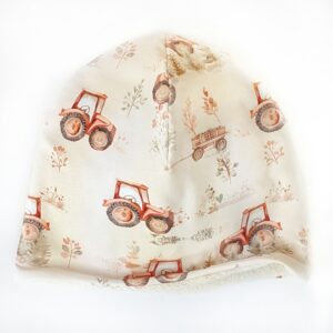 Fleecefodrad mössa med traktorer på sand